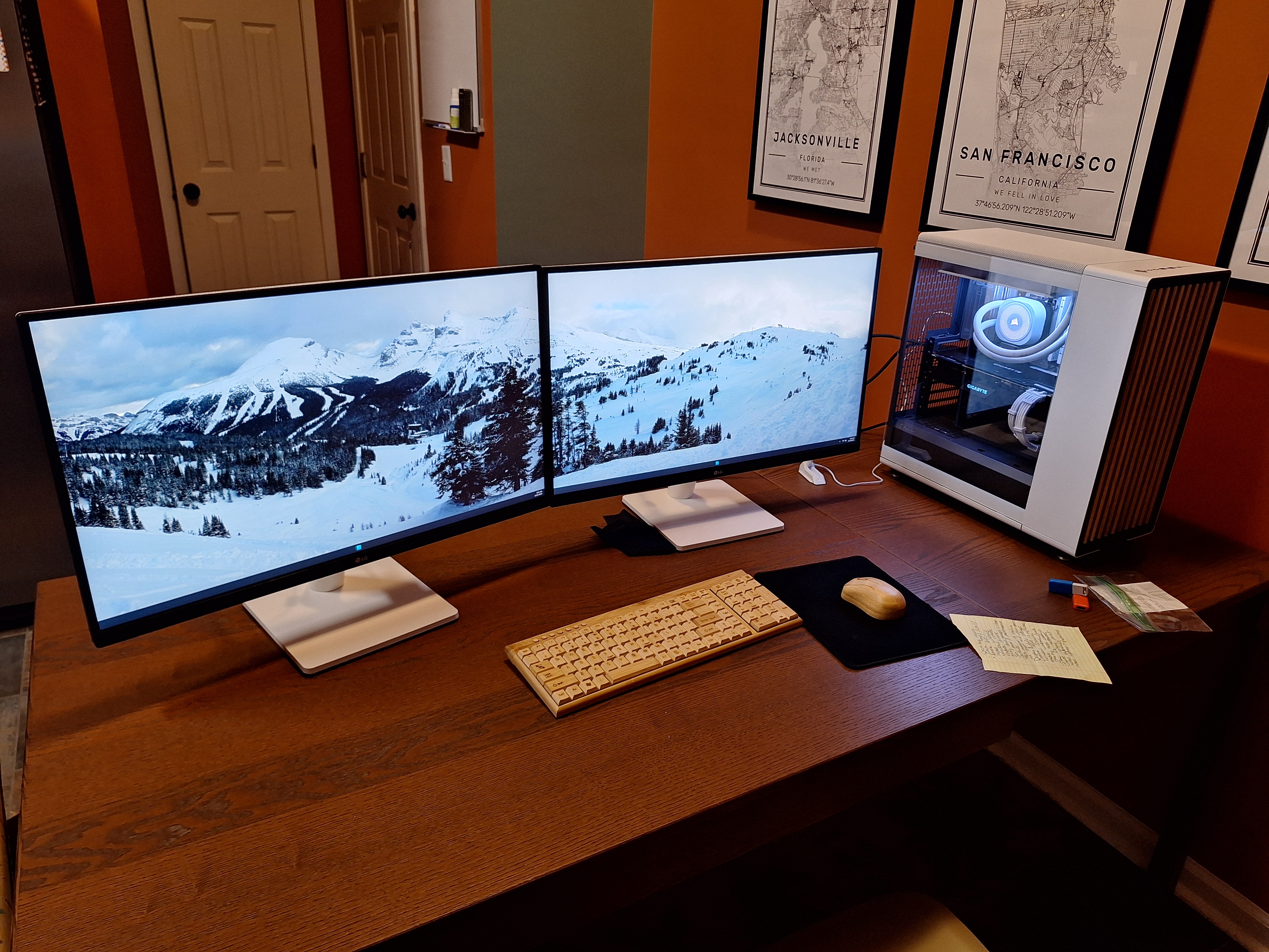 Completed editing workstation with dual monitors and the white Fractal North PC
